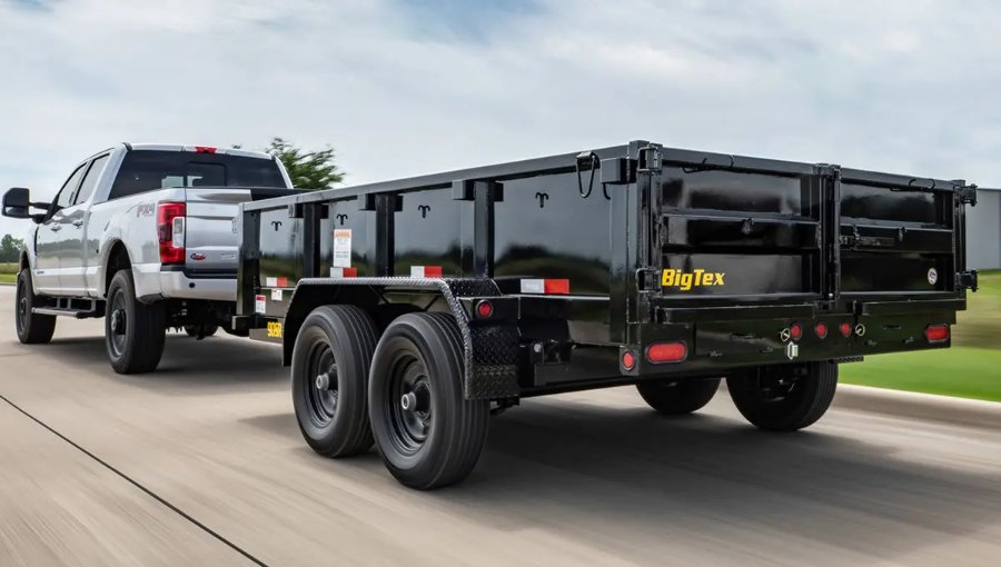 Big Tex dump trailer being towed for a landscaping job